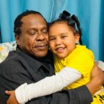 Alumni Sam and his daughter.