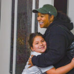 House Manager Daja along with one of the children